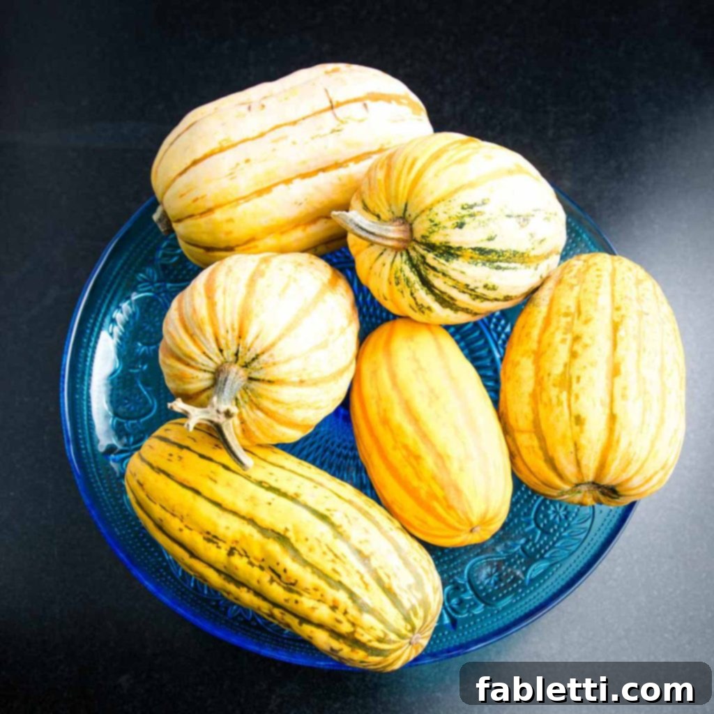 Effortless Plant-Based Flatbread 18 An assortment of whole delicata squash on a pedestal.