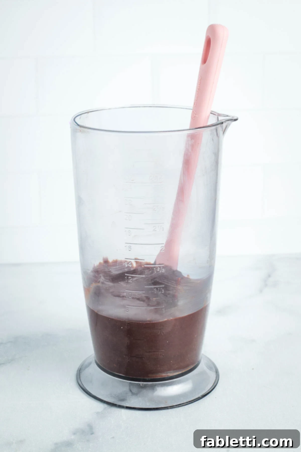 Vegan Flourless Chocolate Cake Delight 14 Chocolate frosting in a blender cup