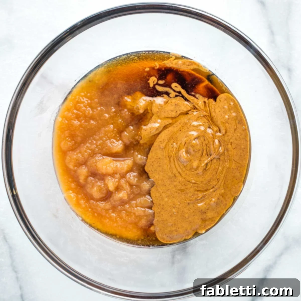 Vegan Flourless Chocolate Cake Delight 4 Mixing applesauce, almond butter, and maple syrup