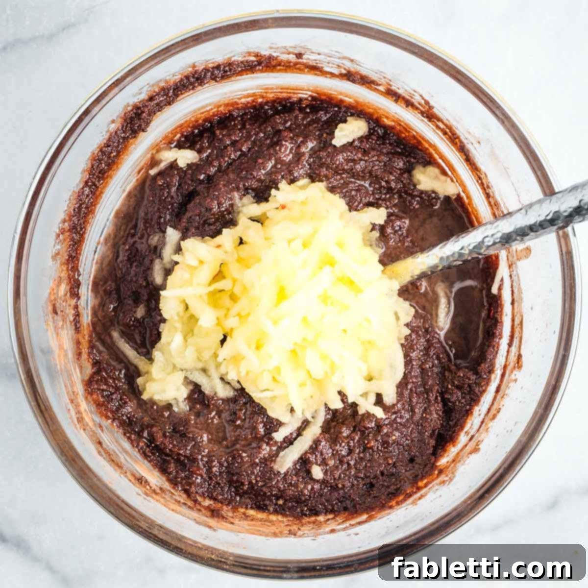 Vegan Flourless Chocolate Cake Delight 7 Adding shredded apple to the cake batter