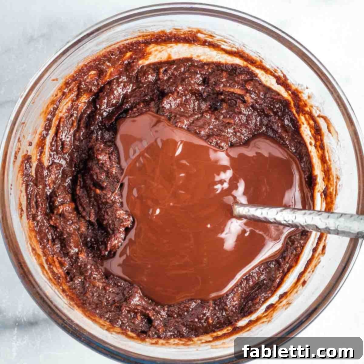 Vegan Flourless Chocolate Cake Delight 8 Pouring melted dark chocolate into the batter