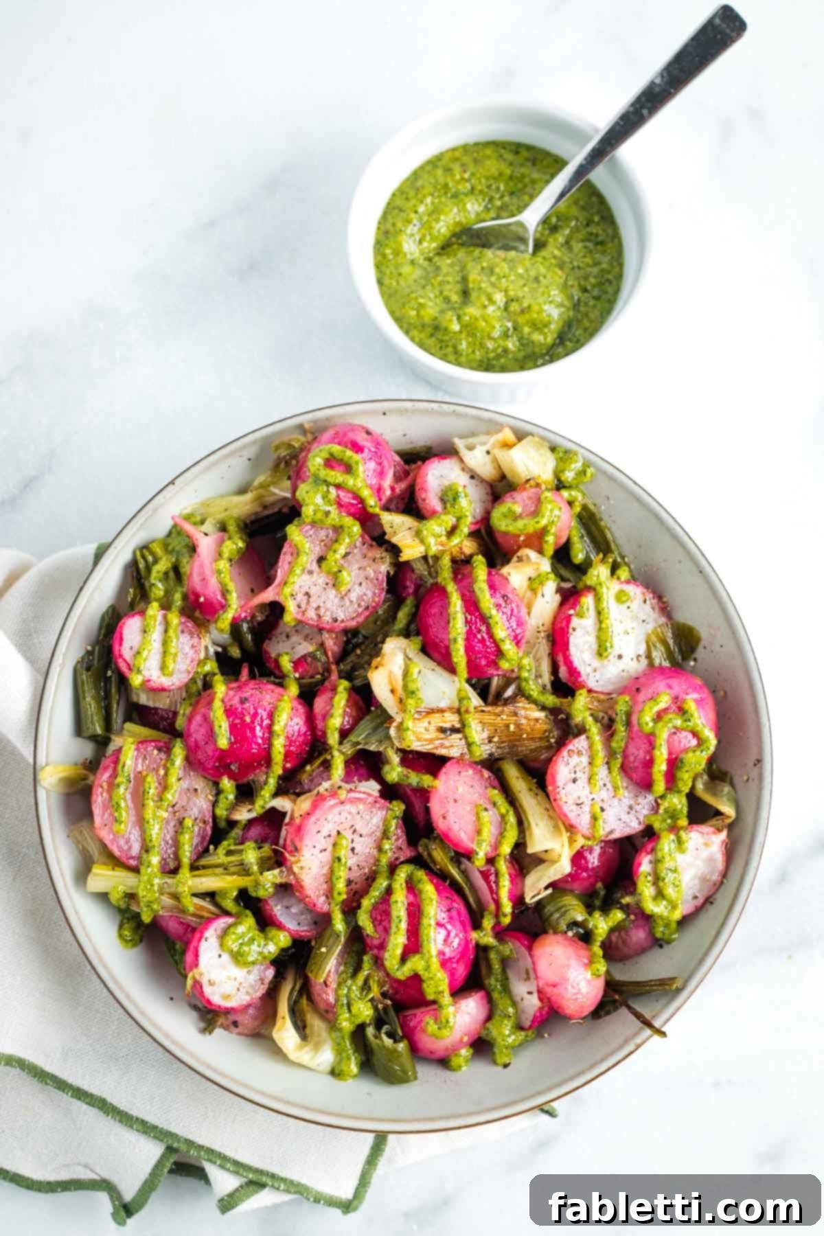 Roasted Radishes with Pistachio-Parsley Drizzle 2 Bowl of roasted radishes and scallions, drizzled with a parsley pistachio dressing.