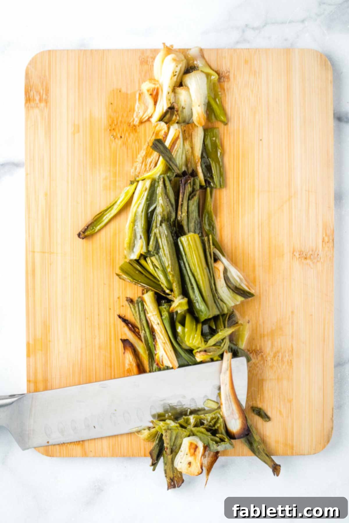 Roasted Radishes with Pistachio-Parsley Drizzle 11 Roughly chopping charred green onions.
