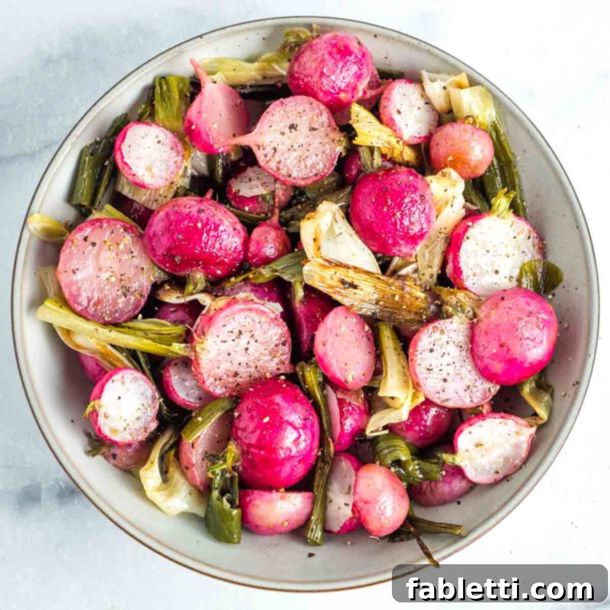 Roasted Radishes with Pistachio-Parsley Drizzle 12 Bowl of halved roasted radishes and scallions sprinkled with salt and pepper.