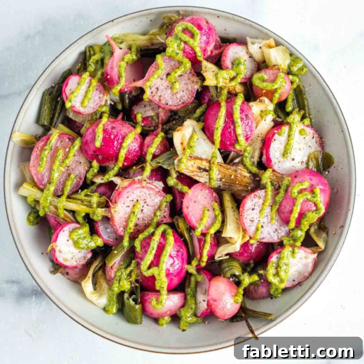 Roasted Radishes with Pistachio-Parsley Drizzle 13 Roasted red radishes and scallions with a pistachio parsley drizzle.