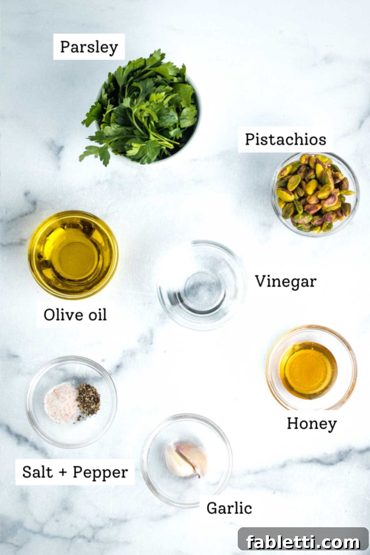 Roasted Radishes with Pistachio-Parsley Drizzle 8 Labeled ingredients: parsley, pistachios, vinegar, olive oil, honey, salt, pepper and garlic cloves.