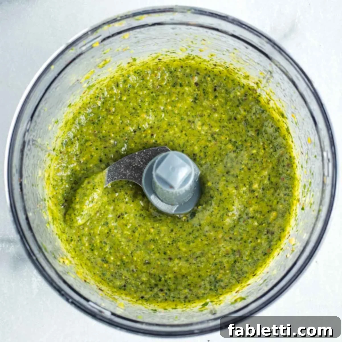 Roasted Radishes with Pistachio-Parsley Drizzle 10 Parsley pistachio vinaigrette in a food processor bowl.