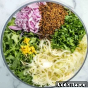 Fennel Arugula Salad with Quinoa Crunch 11 Salad sections with arugula, shaved fennel, thinly sliced onion, crispy quinoa, chopped parsley and lemon zest.