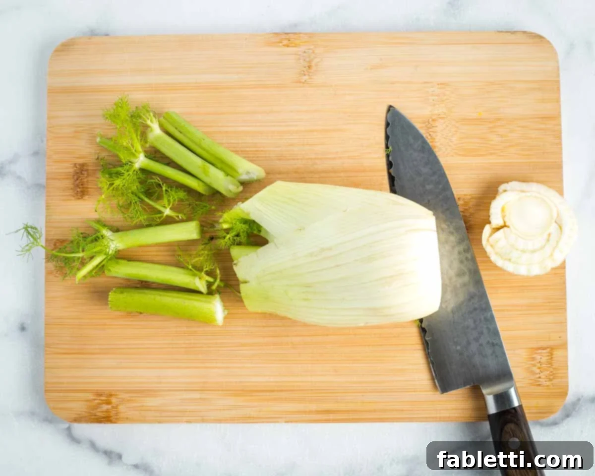 Fennel Arugula Salad with Quinoa Crunch 5 Fennel bulb being prepped for shaving.